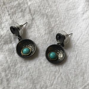 Silver/grey earrings with blue dot.